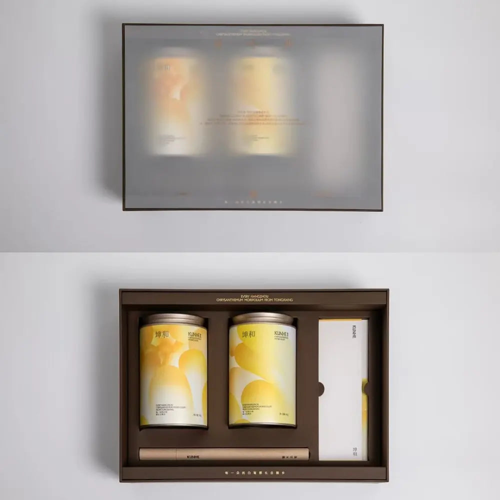 Branded product packaging set combining tea containers, printed materials, and coordinated paper elements.