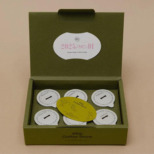 Coffee packaging box opening design with built-in card holder for brand message cards.