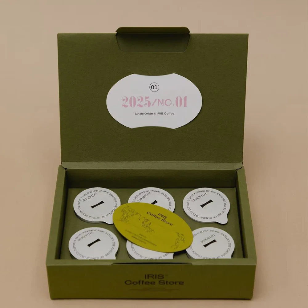 Custom specialty paper coffee packaging with branded insert card and premium paper finish.